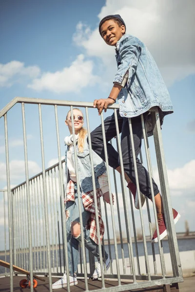 Teenagers spending time at skateboard park — Stock Photo