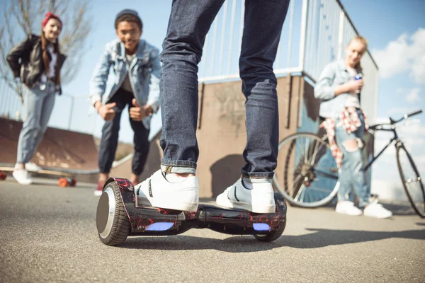 Hipster boy riding gyroboard — Stock Photo