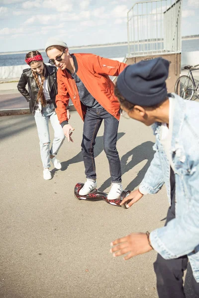 Hipster boy riding gyroboard — Stock Photo