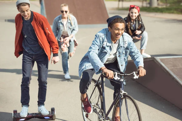 Teenagers spending time at skateboard park — Stock Photo