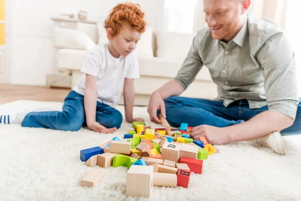 Father and son playing with constructor — Stock Photo