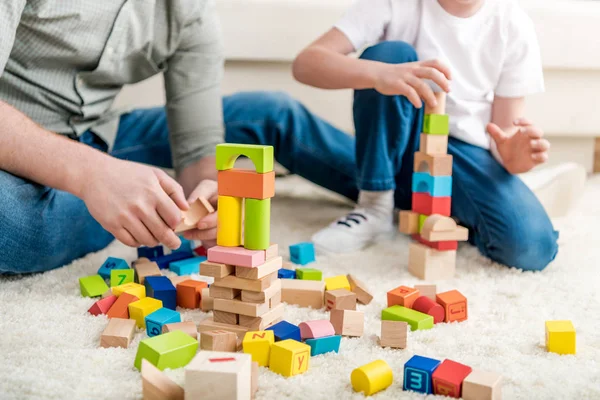 Father and son playing with constructor — Stock Photo