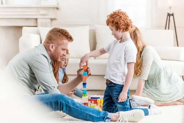 Family playing with constructor — Stock Photo