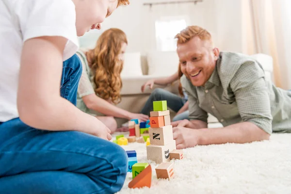 Family playing with constructor — Stock Photo