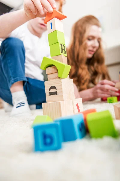 Family playing with constructor — Stock Photo