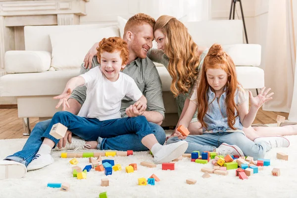 Family playing with constructor — Stock Photo