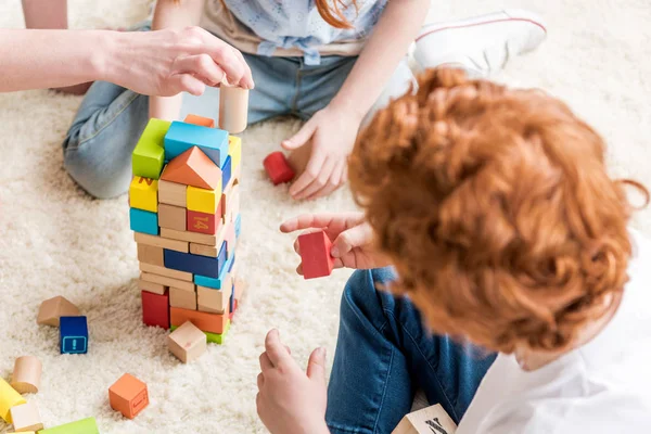 Family playing with constructor — Stock Photo