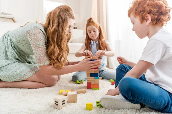 Family playing with constructor — Stock Photo