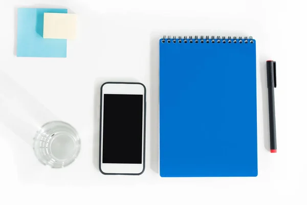 Smartphone and office supplies — Stock Photo