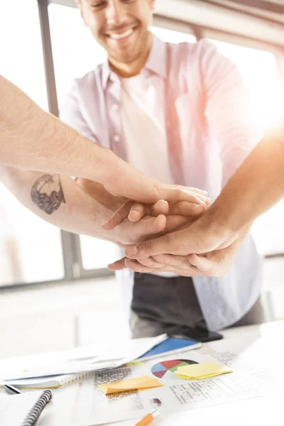 Businessmen stacking hands — Stock Photo