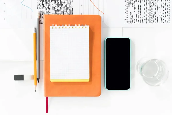 Smartphone and office supplies — Stock Photo