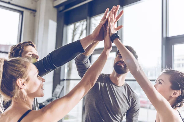 Sporty people giving high five — Stock Photo