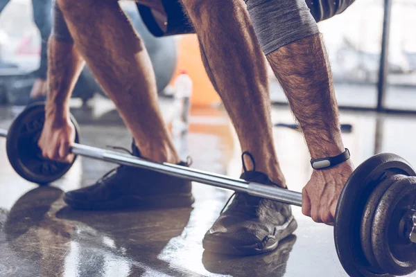 Sportsman lifting barbell — Stock Photo