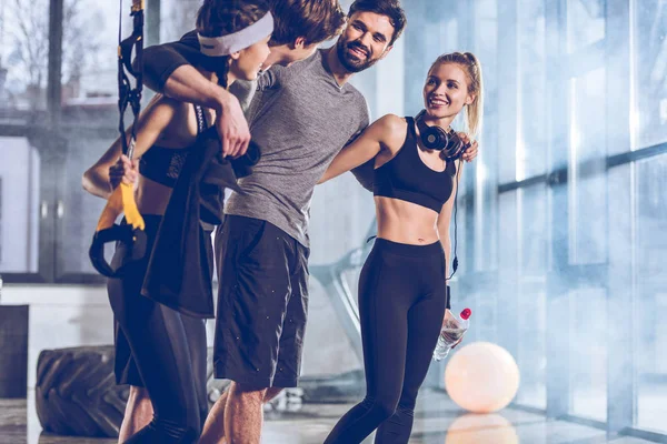 Group of sportive people in gym — Stock Photo