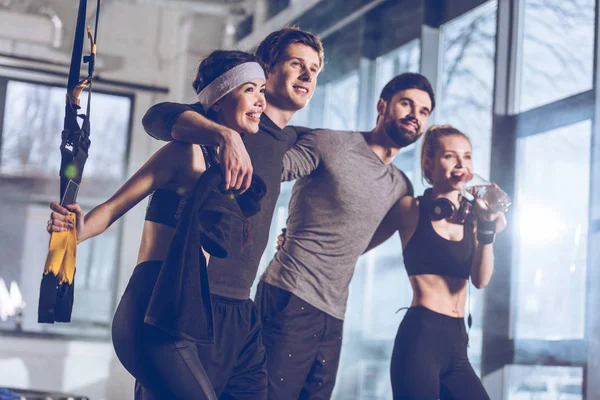 Group of sportive people in gym — Stock Photo