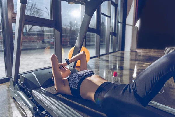 Sportive woman on treadmill — Stock Photo