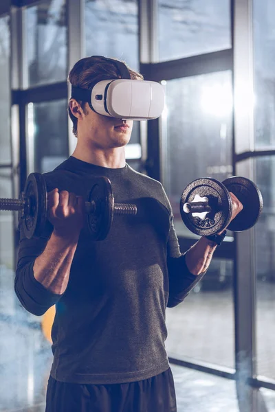 Man exercising with dumbbells — Stock Photo