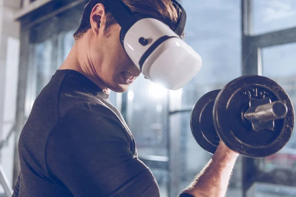 Man exercising with dumbbell — Stock Photo