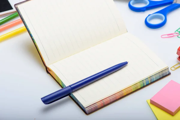 Copybook and school supplies — Stock Photo