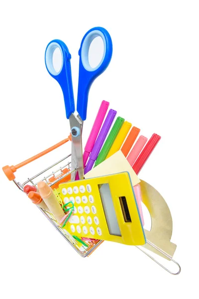 School supplies in shopping cart — Stock Photo