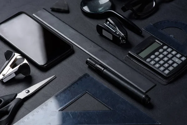 Smartphone with various office utensils — Stock Photo