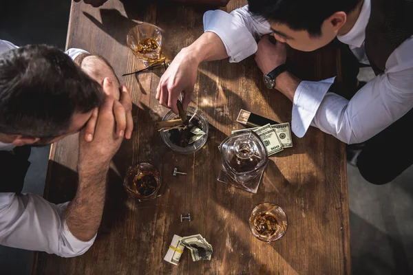 Colleagues drinking alcohol while spending time together after work — Stock Photo