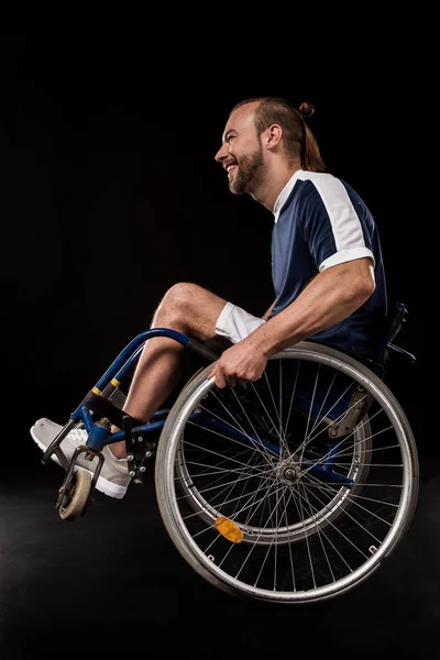 Paralympic in wheelchair smiling — Stock Photo