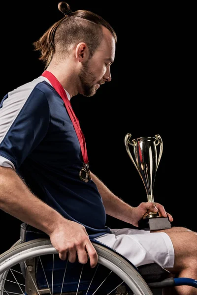 Paralympic in wheelchair with trophies — Stock Photo