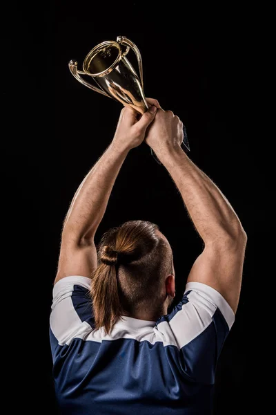 Sportsman holding trophy — Stock Photo