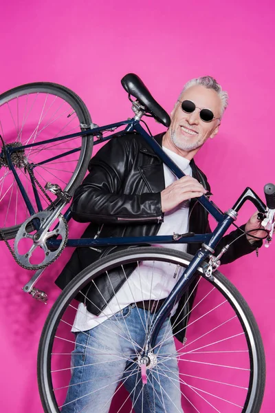 Stylish senior man with bicycle — Stock Photo