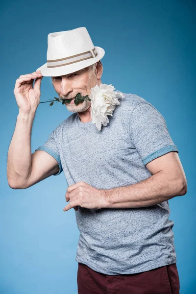 Stylish senior man with flower — Stock Photo