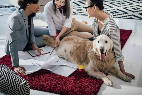 Businesswomen working with blueprints — Stock Photo