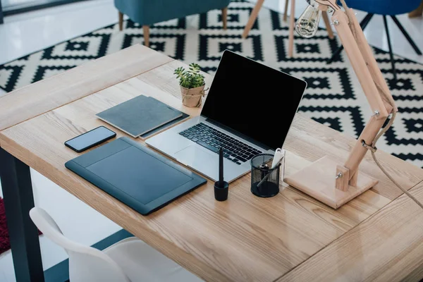 Digital devices on office table — Stock Photo