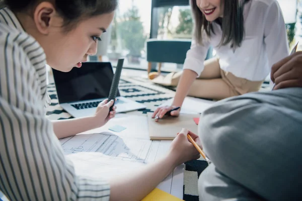 Businesswomen working with blueprint — Stock Photo