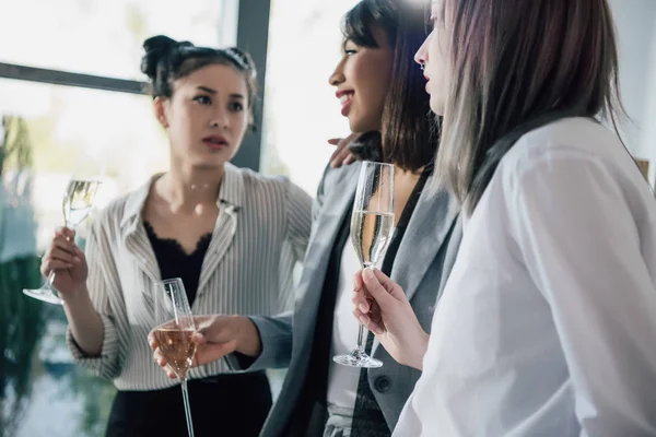 Businesswomen drinking champagne — Stock Photo