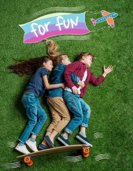 Children standing on skateboard — Stock Photo