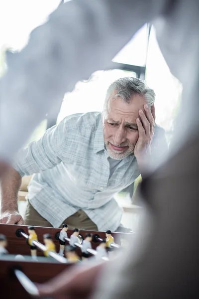 Colleagues playing foosball — Stock Photo