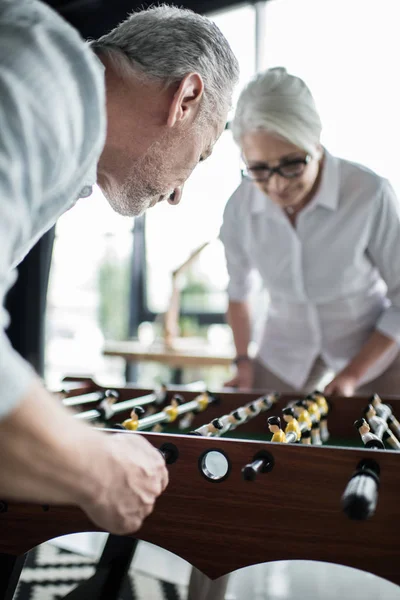 Colleagues playing foosball — Stock Photo