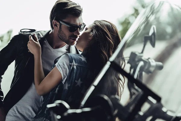 Young couple with motorcycle — Stock Photo