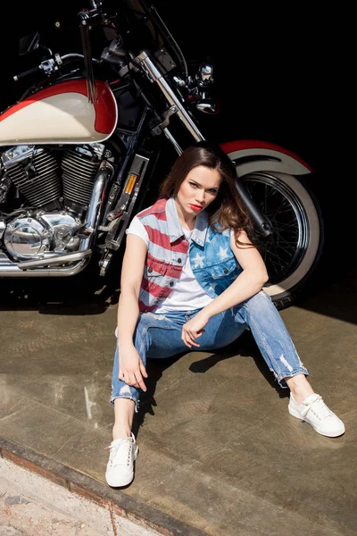 Young woman with motorbike — Stock Photo