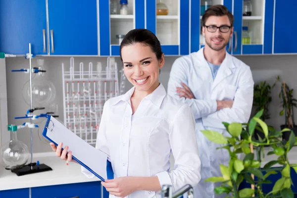 Scientists during work at laboratory — Stock Photo