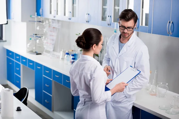 Scientists during work at laboratory — Stock Photo