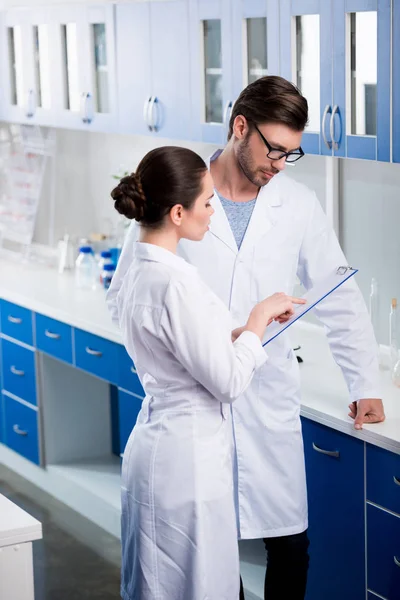 Scientists during work at laboratory — Stock Photo