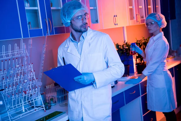 Scientists during work at laboratory — Stock Photo