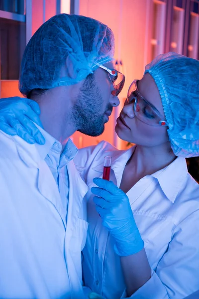 Scientists having office romance — Stock Photo