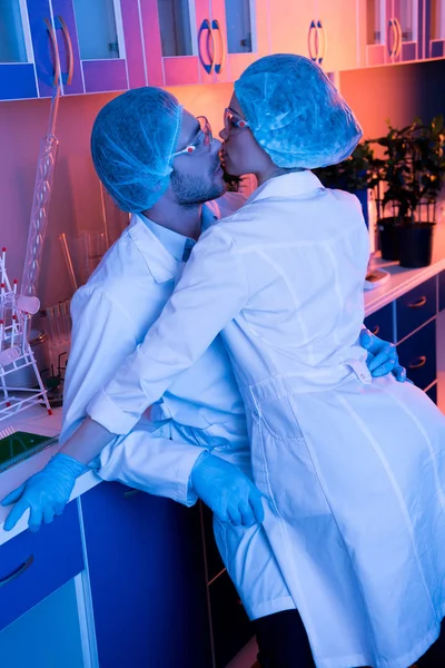 Scientists having office romance — Stock Photo