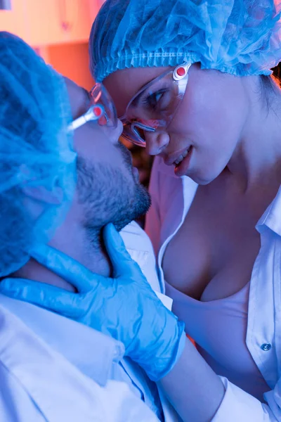 Scientists having office romance — Stock Photo