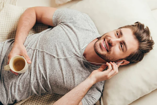 Young man in earphones — Stock Photo