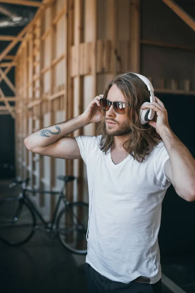 Young man in headphones — Stock Photo