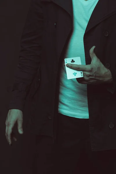 Casual man holding playing card — Stock Photo